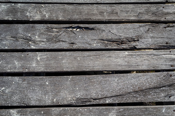 weathered wooden planks of seaside dock for background and texture