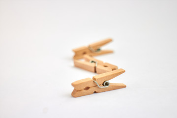 wooden clothespins on white background