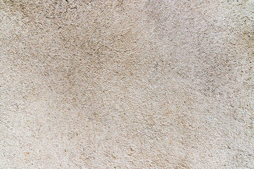 yellowish cement textured wall