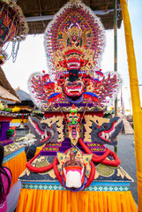 Hindu offerings prepared for ceremonies at Ulun Danu Temple on Bali Island in Indonesia. Traditional offerings to gods with flowers and aromatic sticks. Food or vegetable offerings for the gods. 