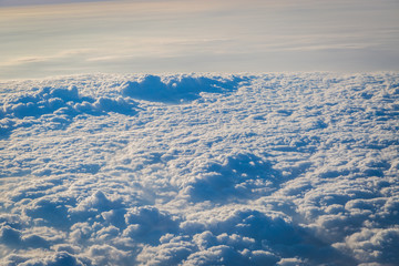Sky and clouds from above the ground viewed from an airplane