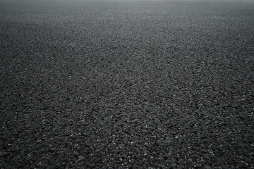 Texture of rough asphalt road. Tarmac grey grainy road, Black asphalt background.