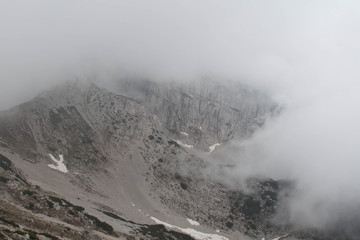 The view from Rifugio Telegrafo on mountains covered with clouds.