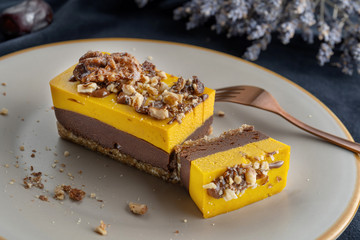 Homemade pumpkin pie with chocolate, and nuts. Sprinkled with walnuts. Macro.