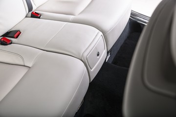 Closeup shot of the beige leather seats of a modern car