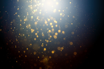 Fototapeta na wymiar Dark Abstract Gold bokeh sparkle