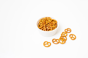 Pretzels in a white bowl with isolated white background