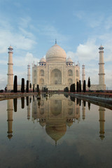 reflection of the Taj mahal mausoleum in the city of agra in the uttar pradesh province in India 