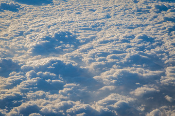 Sky and clouds from above the ground viewed from an airplane