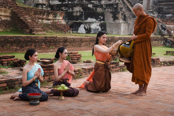 Offering alms to monks Is the merit of Buddhism On Lent Day at one of the old temples In Phra Nakhon Si Ayutthaya province, Thailand