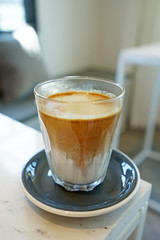 Close up glass of latte coffee