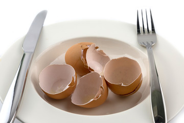 Egg shell on white plate diet concept