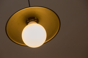 Lamp hanging on a gray wall