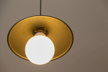 Lamp hanging on a gray wall