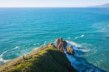A Girl Hiking and Exploring Coastal Cliffs and Waves in Big Sur, California