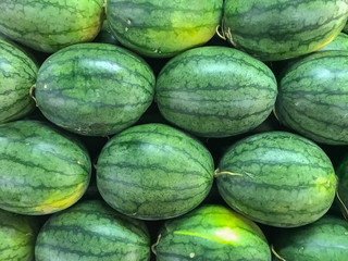 Arranging watermelons into piles