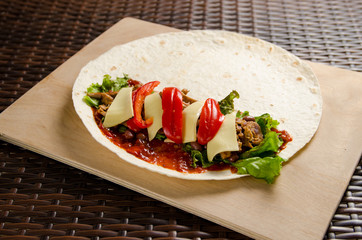 Chicken roll in the cooking process. Preparing for wrapping