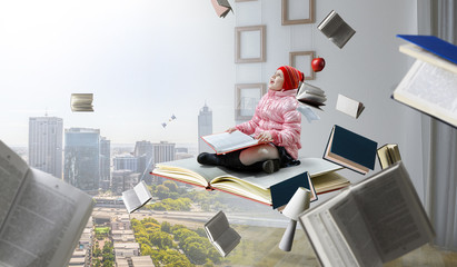 Little girl reading a book
