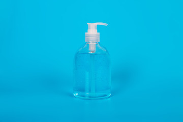 Alcohol gel Sanitizer hand gel cleaners for anti Bacteria and virus on Blue Background, People using alcohol gel to wash hands to prevent Coronavirus (COVID-19)