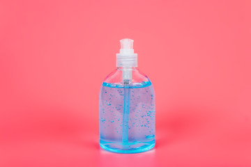 Alcohol gel Sanitizer hand gel cleaners for anti Bacteria and virus on Pink Background, People using alcohol gel to wash hands to prevent Coronavirus (COVID-19)