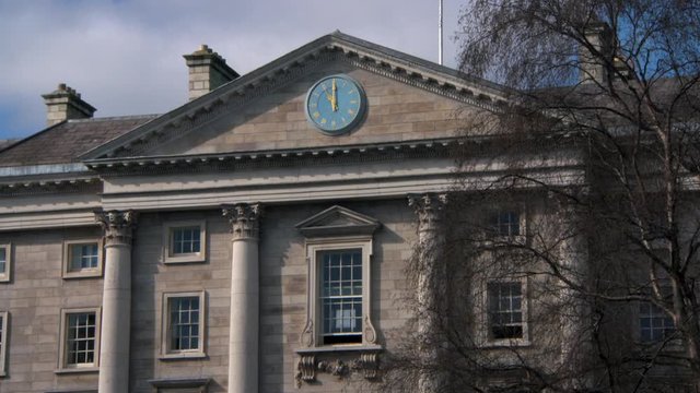 Wide Angle: A Blue Clock on Trinity College Building in Dublin, Ireland