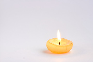 Obraz na płótnie Canvas burning candle on white background
