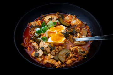 Korean spicy silken tofu stew which is called Sundubu Jjigae