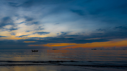 Fototapeta na wymiar Boats at achor in the Gulf of Thailand at sunset