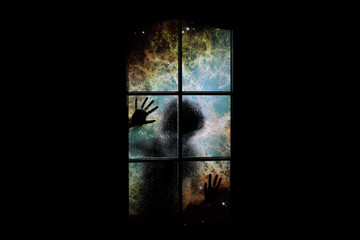 Soul in outer space with nebula and many stars behind closed door. Сhild locked in dark room in...