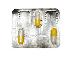 Packing oval yellow pills, tablets, pastils. Isolated on a white.