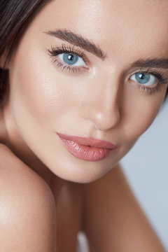 Beauty. Young Woman Close Up Portrait. Beautiful Blue-Eyed Model With Perfect Skin And Natural Daily Makeup Looking Away.