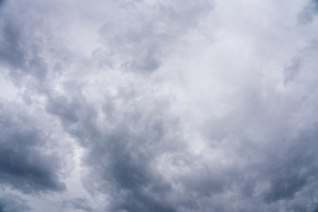 Cloudy Sky Background with thick layers of grey clouds
