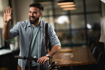 Young man on e-scooter. Businessman driving electric scooter in office.	