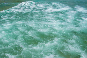 Fototapeta na wymiar Sea texture, beautiful turquoise water waves with white foam, powerful nature concept, full frame, ocean