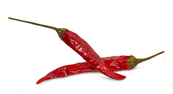 Dried red hot peppers isolated on white.