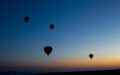 Hot Air balloon flying in Turkey Goreme Capadocia sky sunset sunrise