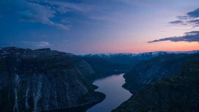 Time lapse of Trolltunga mountain cliff at sunset, most famous mountain hiking route in Norway in summer season, Norway, Scandinavia, Europe