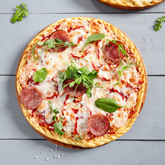 Prosciutto Funghi pizza on wooden board