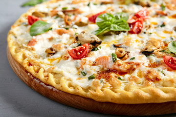Seafood pizza on wooden board
