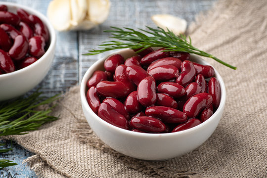 Canned red kidney beans in white bowl on a table