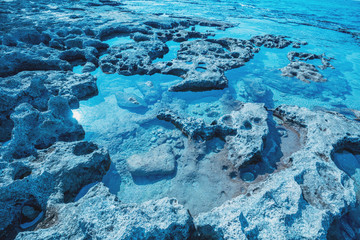 Rocky seashore. Nature rocky background. Blue toned