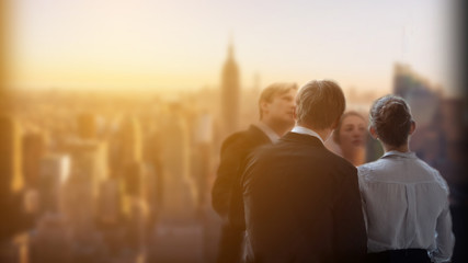 Fototapeta premium Businessmen and businesswomen is looking cityspace view very happy successful.Male and Female conference meeting customer about investment digital marketing financial technology on tall building 