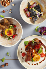 Appetizers in ceramic dishes top view