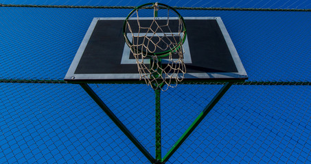 basketball hoop on synthetic court