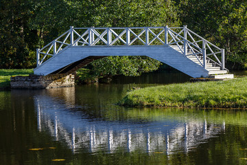Fototapeta na wymiar Pond with bridges in the park of Vihula manor house, Estonia