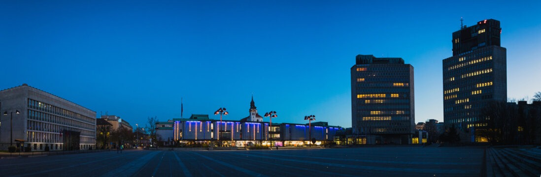 Cityscape or panorama of trg republike in the capital of Ljubljana, Slovenia, taken during blue hour in december, with visible decorations.