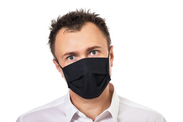 Man in medical mask with tousled hair Isolated on a white background. Concept on the topic of annoying quarantine and the inability to cut your hair