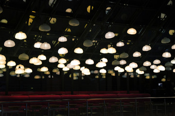 An empty cafe with a lot of Chinese lamps