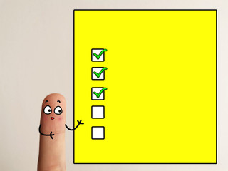 One finger is decorated as one person. The person is standing beside a yellow screen with three...
