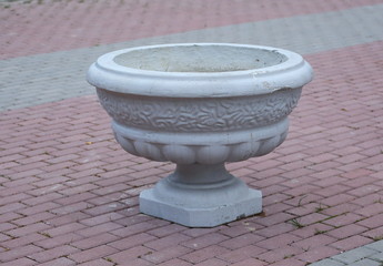 Blank white round concrete flower bed